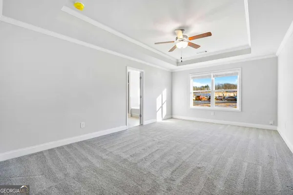 a view of an empty room with a window