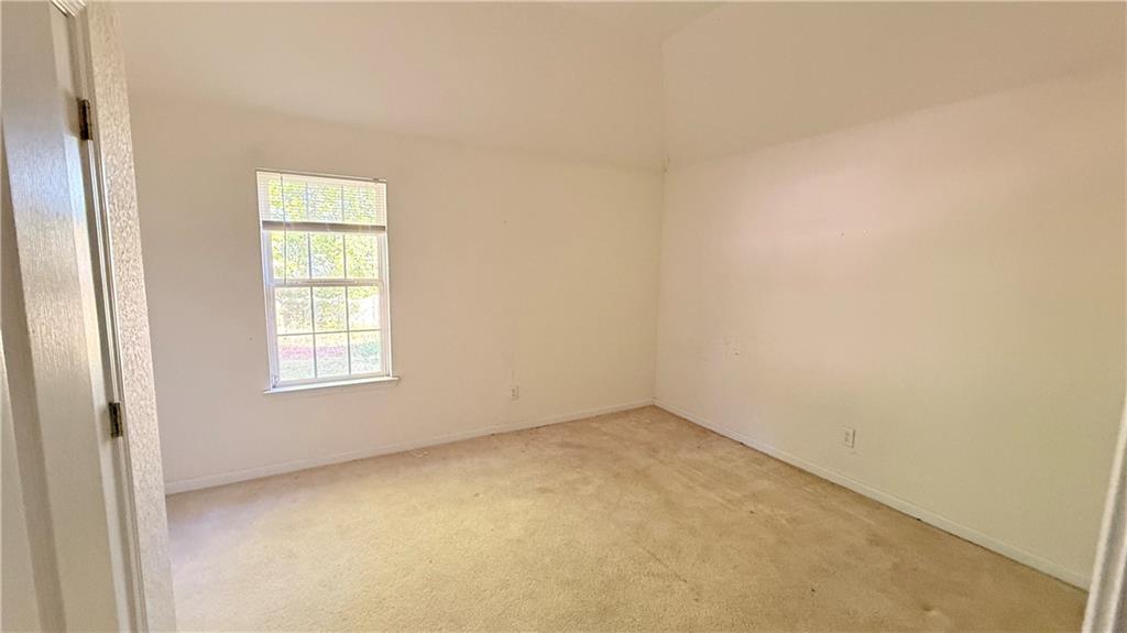 65 Lakeridge Court Covington, GA 30016 - Photo 17 of 17 an empty room with a window