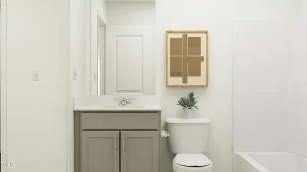 a bathroom with a sink toilet and mirror