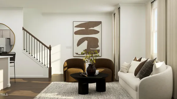 a living room with furniture and a potted plant