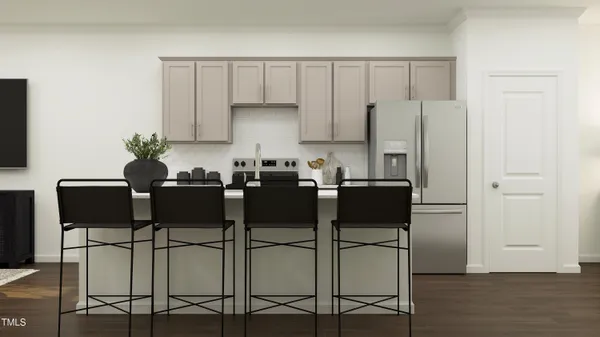 a kitchen with a table chairs and cabinets