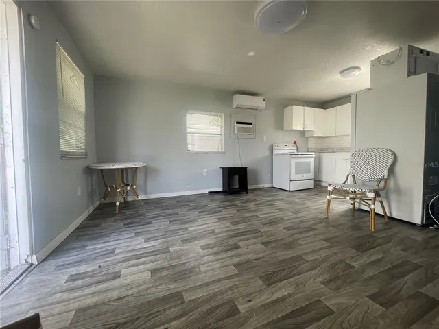 a view of kitchen with furniture and window