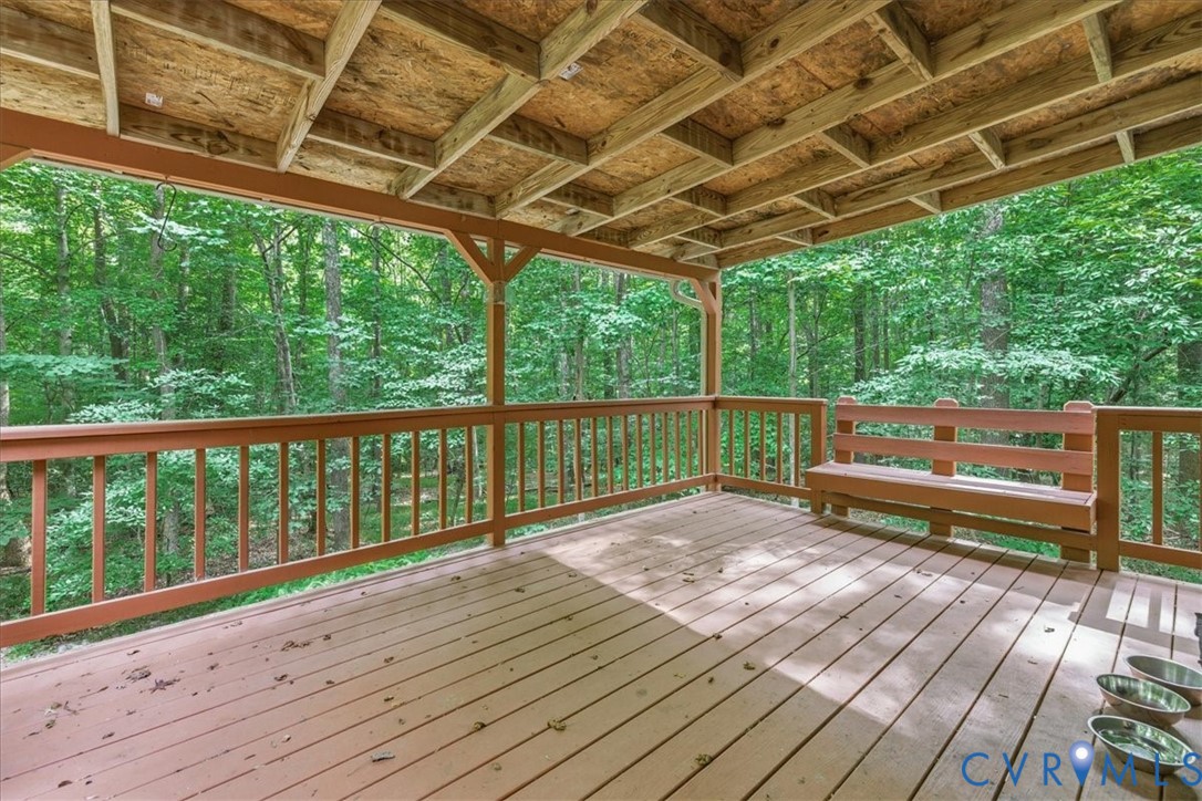 4099 Doe Run Road Hopewell, VA 23860 - Photo 11 of 36 Spacious covered deck with wood flooring and a bui