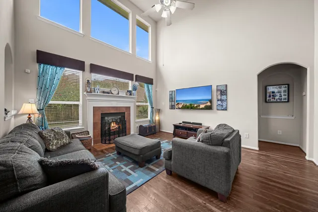 a living room with furniture and a fireplace