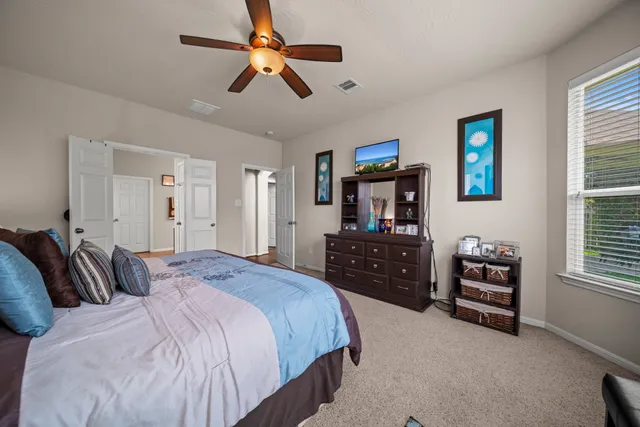 a bedroom with a bed and furniture