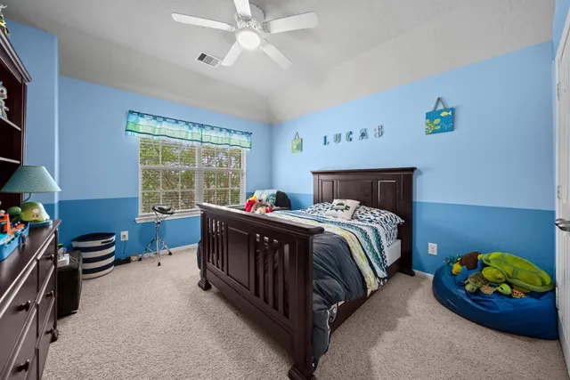 a bed room with a bed and a window