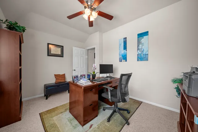 a work room with furniture and wooden floor