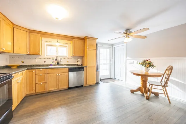 a kitchen with a sink cabinets a counter top space and stainless steel appliances