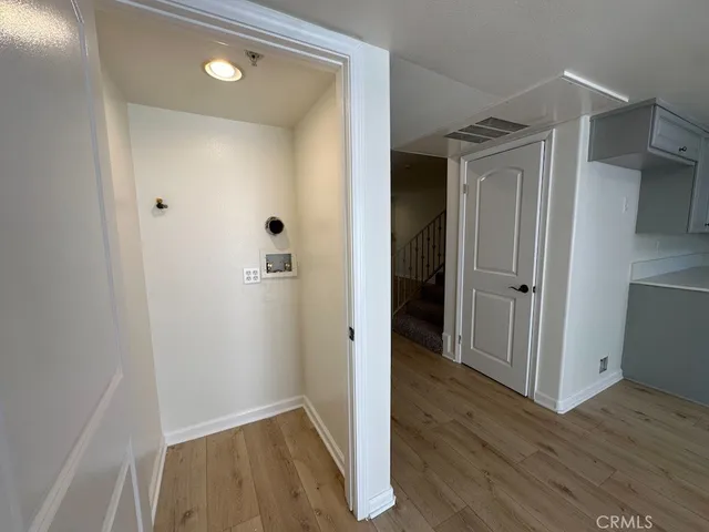 a large kitchen with a stove a sink dishwasher and a refrigerator