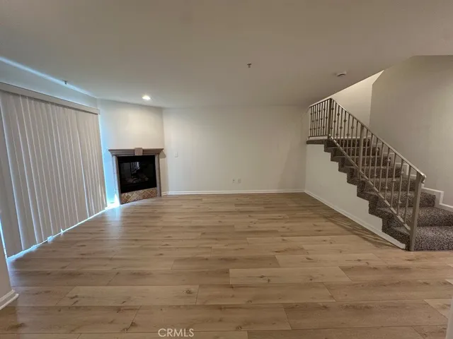 a kitchen with sink a microwave and cabinets