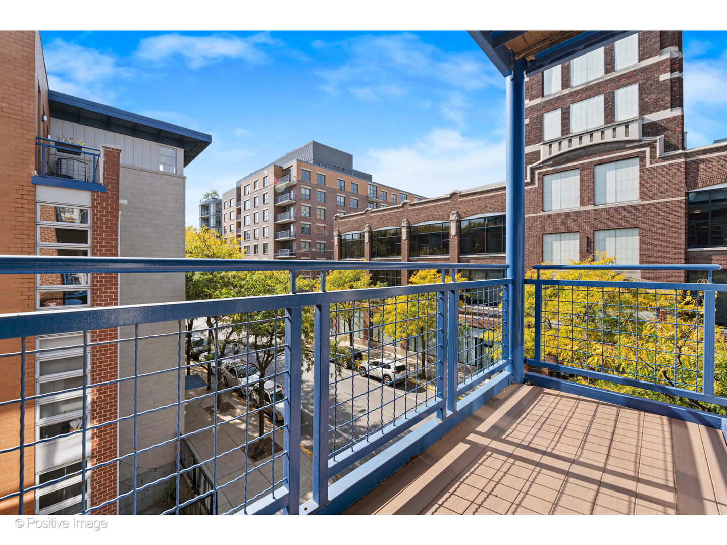1151 West Washington Boulevard, Unit 136 Chicago, IL 60607 - Photo 16 of 19 a view of balcony with wooden floor and outdoor seating