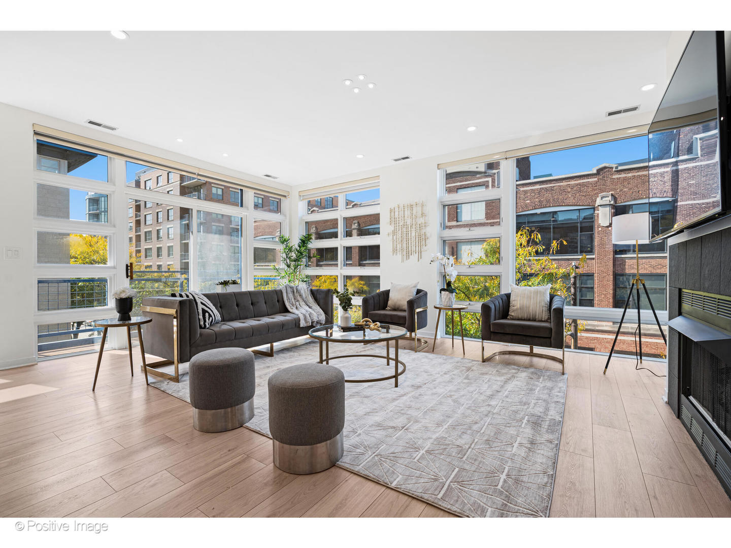 1151 West Washington Boulevard, Unit 136 Chicago, IL 60607 - Photo 2 of 19 a living room with furniture and a wooden floor