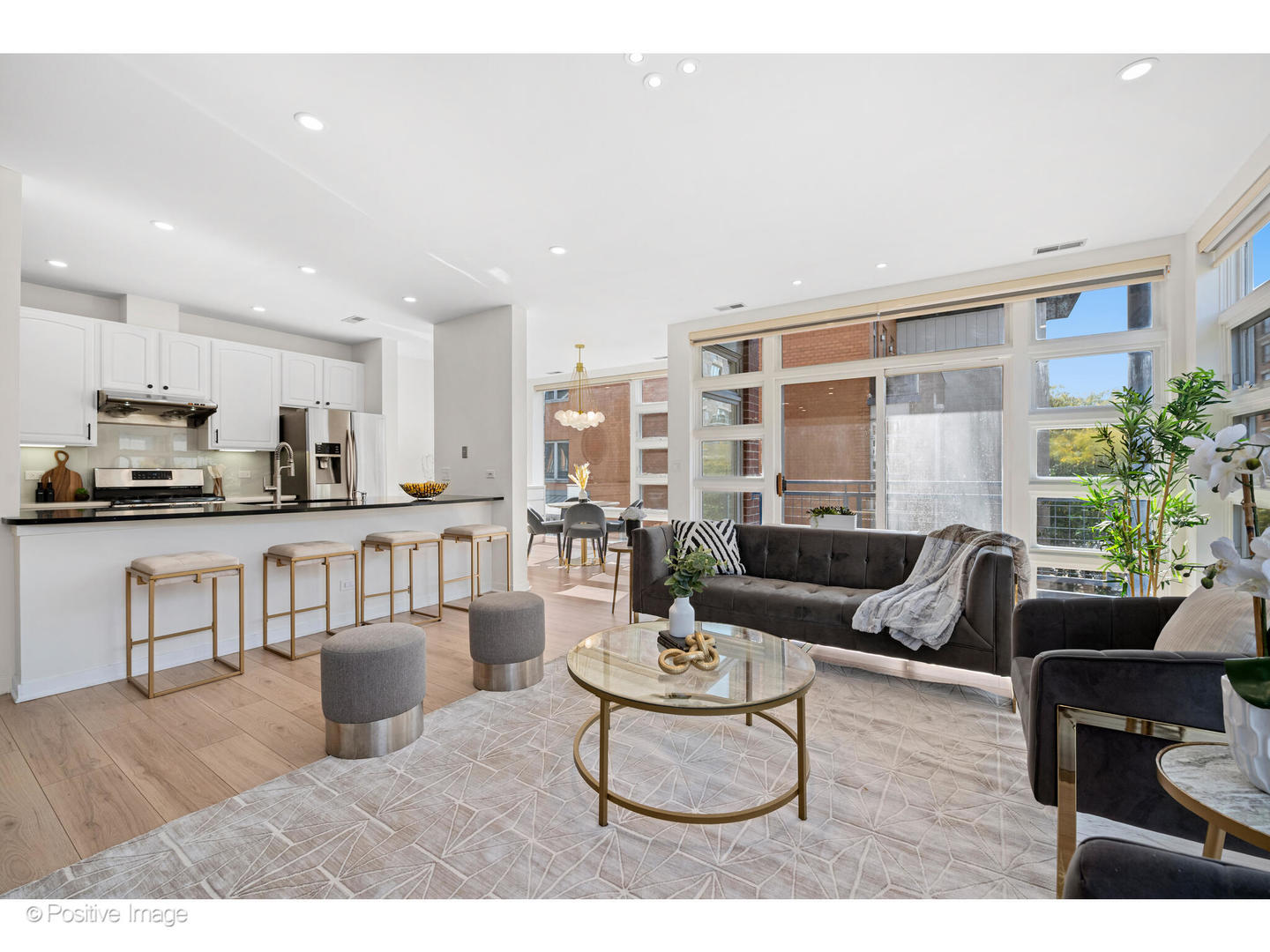 1151 West Washington Boulevard, Unit 136 Chicago, IL 60607 - Photo 3 of 19 a living room with furniture and a view of kitchen