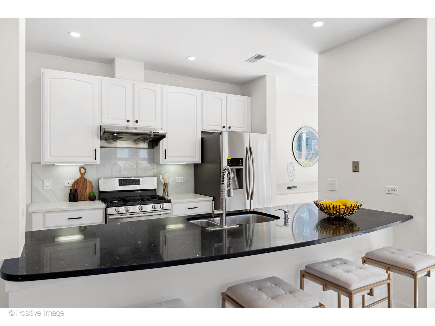 1151 West Washington Boulevard, Unit 136 Chicago, IL 60607 - Photo 7 of 19 a kitchen with stainless steel appliances granite countertop a sink stove and refrigerator