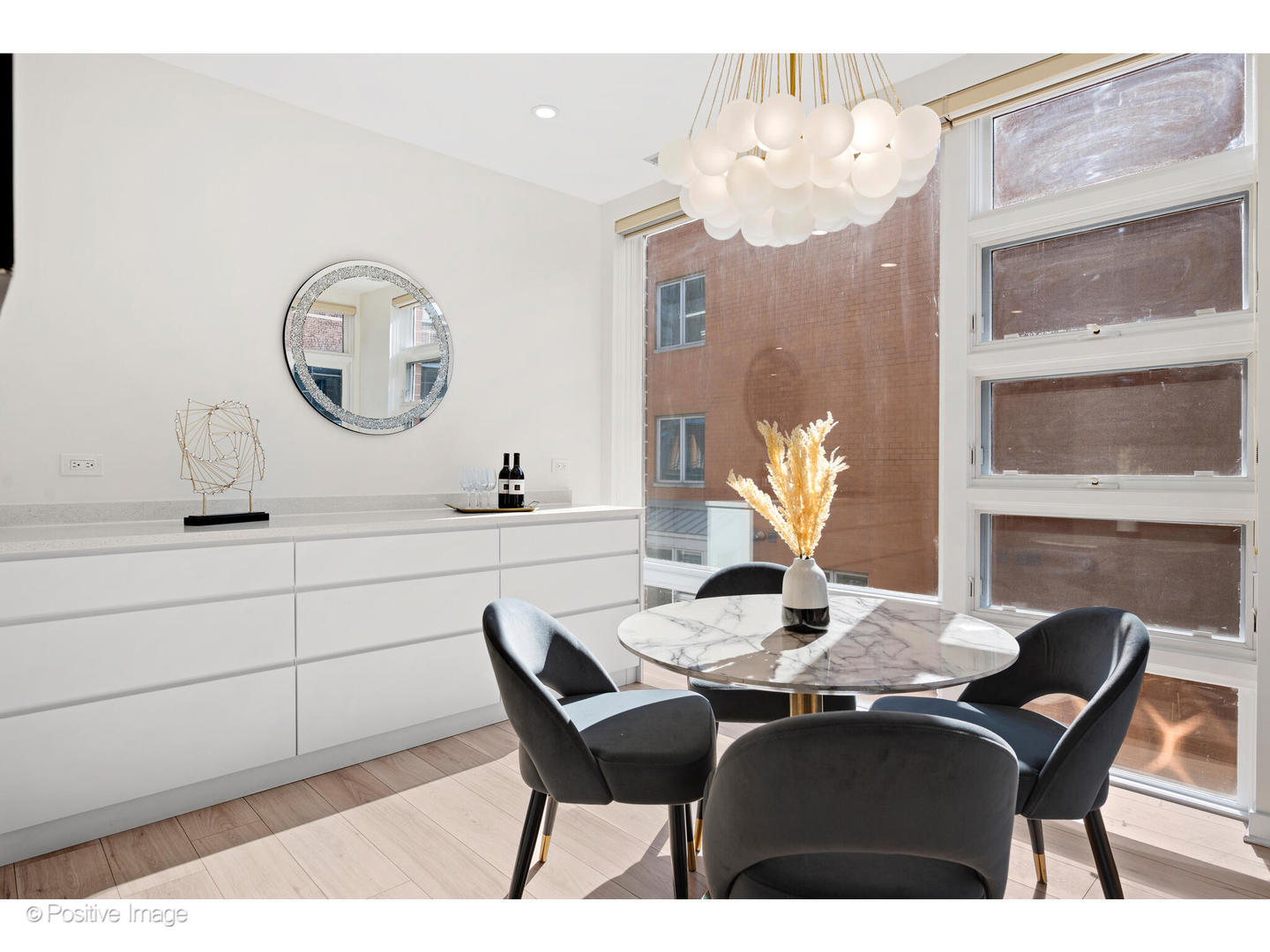1151 West Washington Boulevard, Unit 136 Chicago, IL 60607 - Photo 9 of 19 a view of a dining room with furniture and chandelier