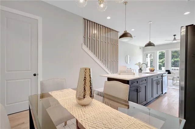 a kitchen with sink and refrigerator