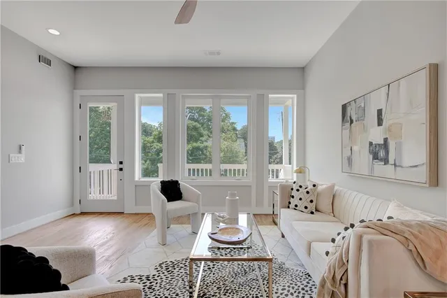 a living room with furniture and a large window