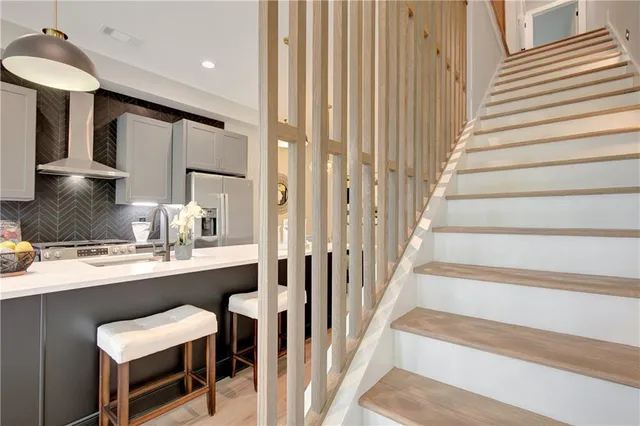 a view of kitchen with sink and microwave