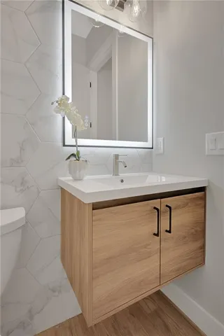 a bathroom with a sink and a mirror
