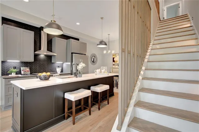 a kitchen with a sink cabinets and wooden floor