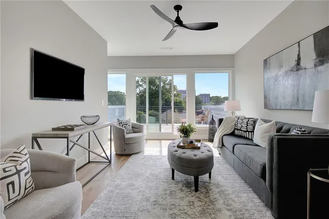 a living room with furniture and a flat screen tv
