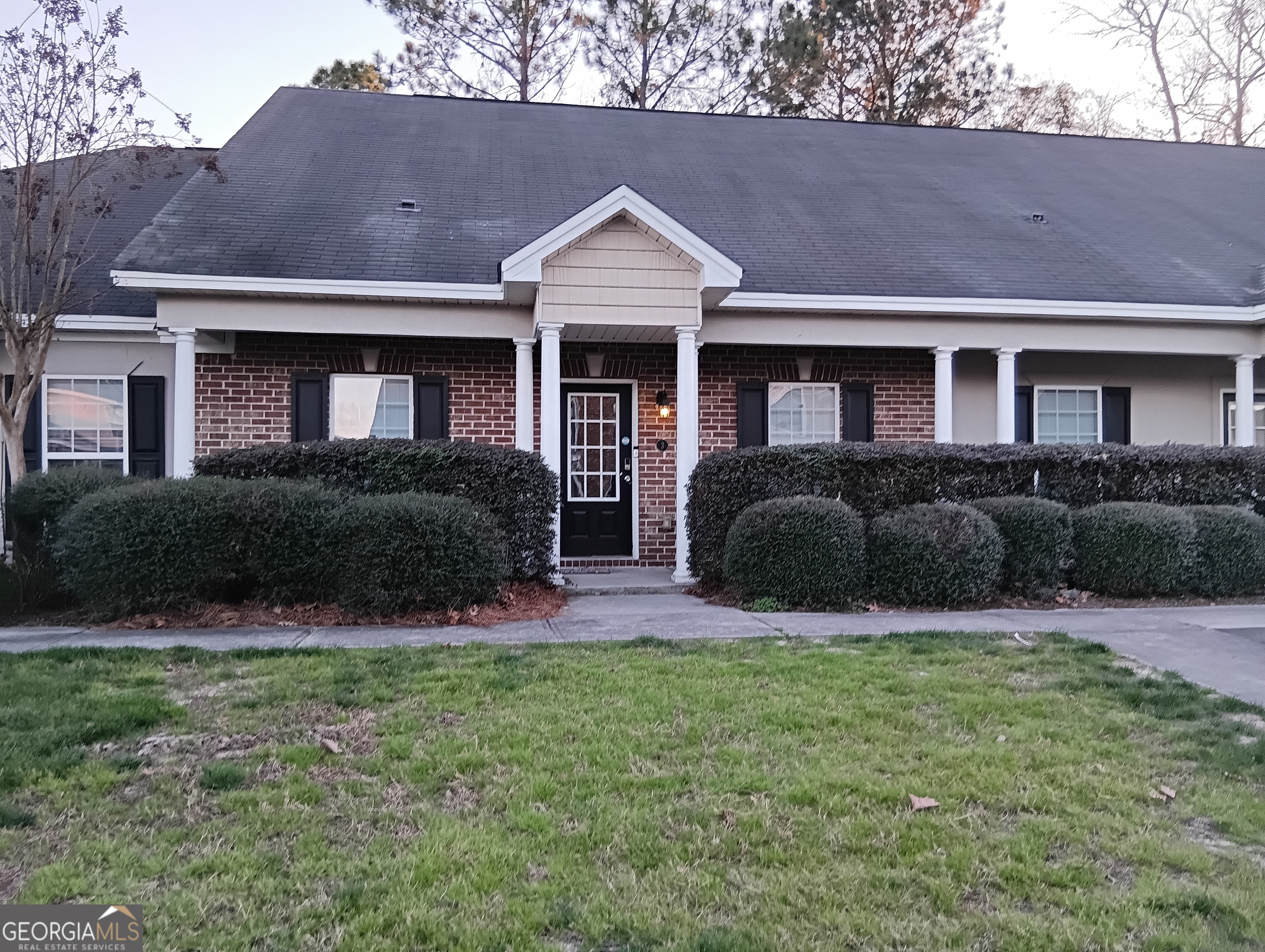 3 Reese Way Savannah, GA 31419 - Photo 1 of 8 a front view of a house with a yard and outdoor seating