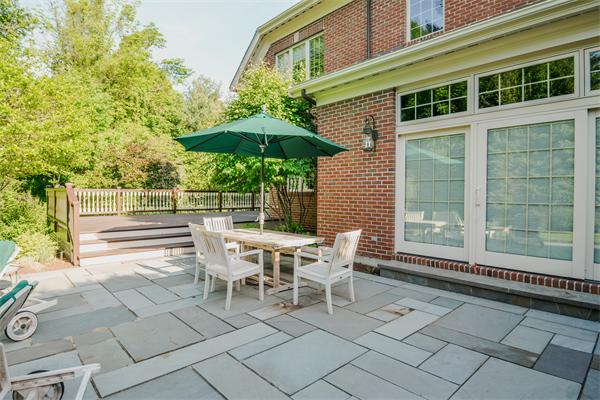 32 Clark Road Andover, MA 01810 - Photo 11 of 28 a view of a patio with a table and chairs under an umbrella