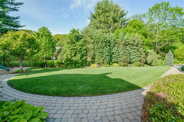 32 Clark Road Andover, MA 01810 - Photo 23 of 28 a view of a garden with a fountain