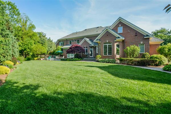 32 Clark Road Andover, MA 01810 - Photo 24 of 28 a front view of a house with a yard and trees