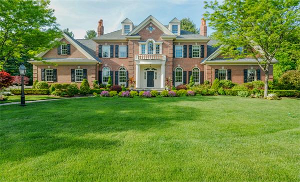 32 Clark Road Andover, MA 01810 - Photo 3 of 28 a front view of a house with a garden