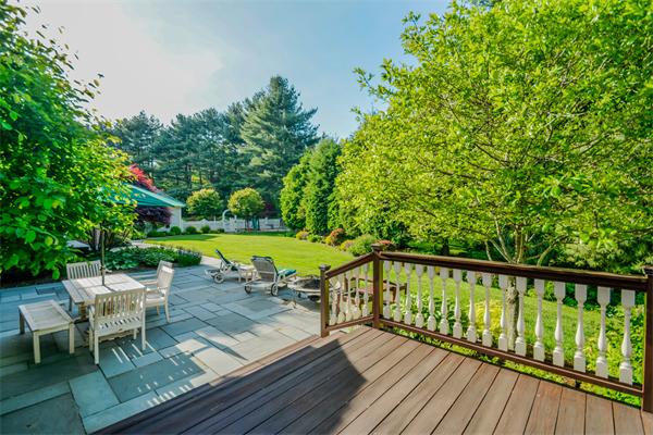 32 Clark Road Andover, MA 01810 - Photo 9 of 28 a view of a chairs and table on the wooden deck