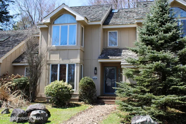 front view of a house with a yard