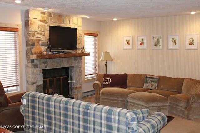 a living room with furniture and a flat screen tv