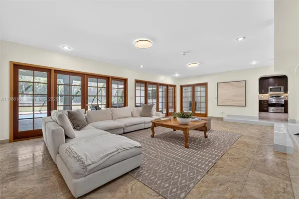 a view of a house with pool and wooden floor