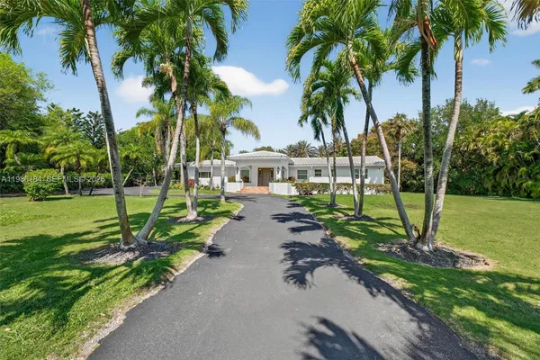 a view of a road with a building in the background
