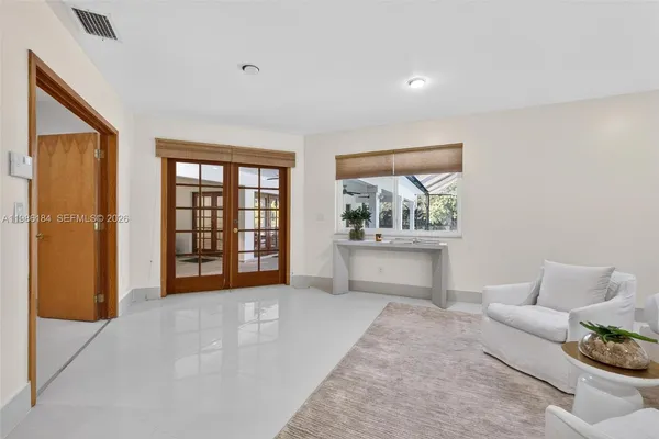 a en suite bathroom with a tub sink and view bedroom
