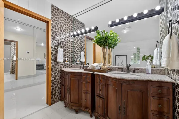 a bedroom with bed and wooden floor