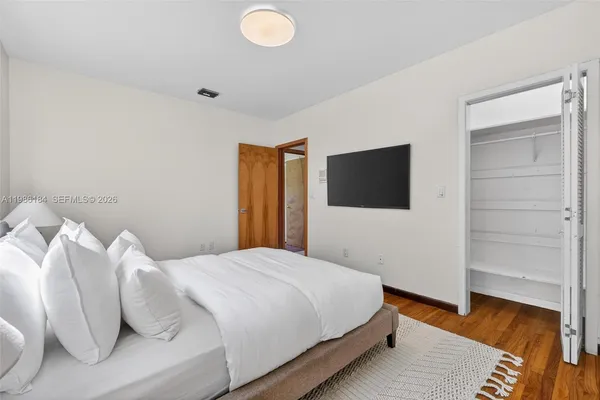 an aerial view of a house with swimming pool and garden