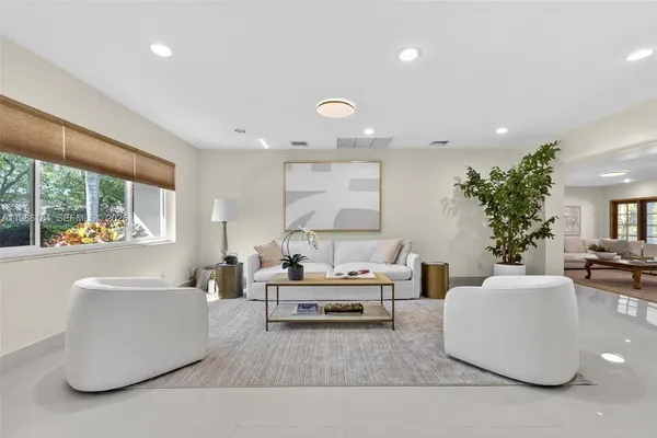 a kitchen with stainless steel appliances granite countertop wooden cabinets a stove a sink and a refrigerator