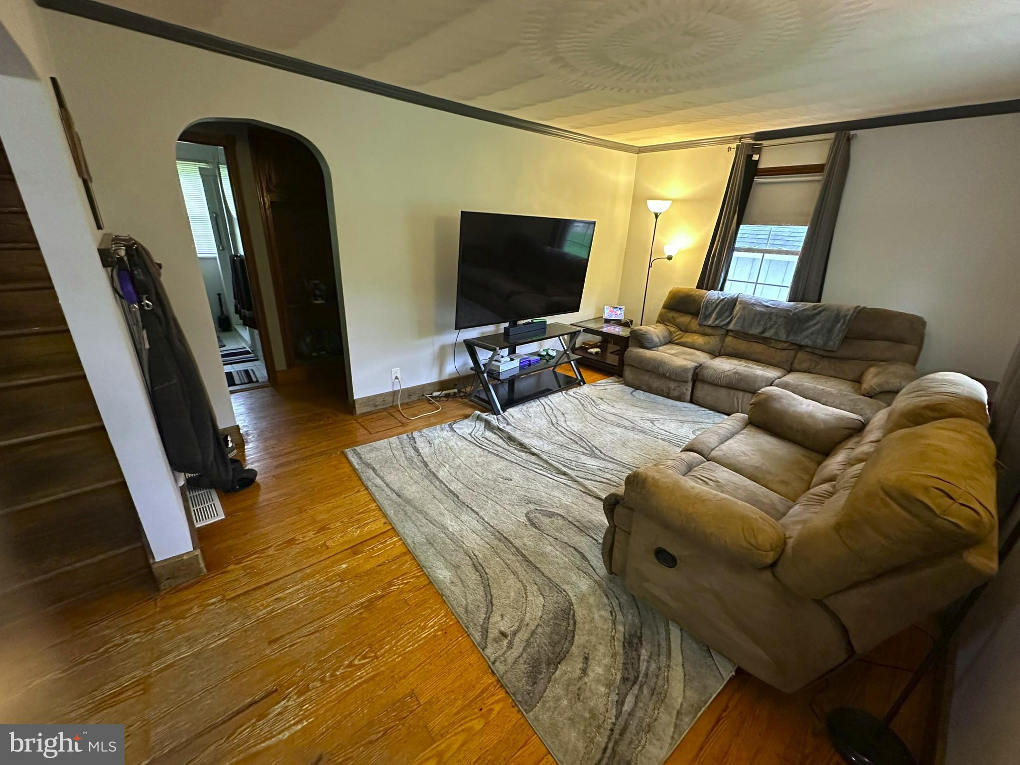 407 Upper Snake Spring Road Everett, PA 15537 - Photo 11 of 58 a living room with furniture and a flat screen tv