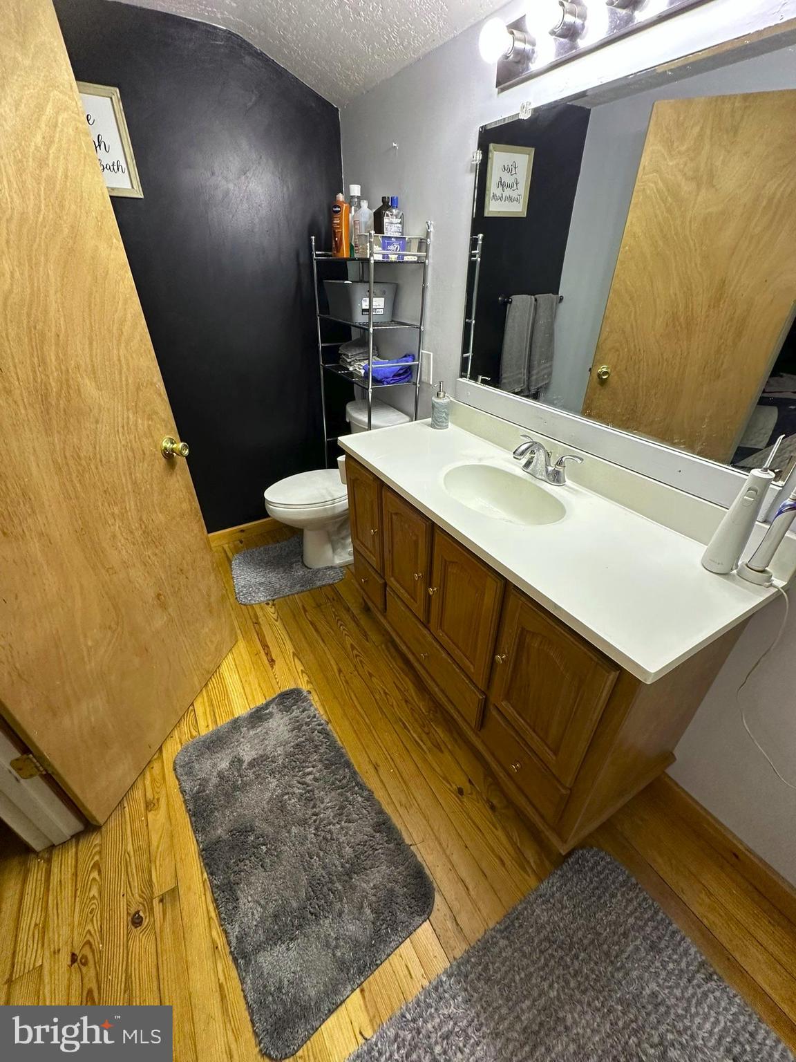 407 Upper Snake Spring Road Everett, PA 15537 - Photo 24 of 58 a bathroom with a sink and a mirror