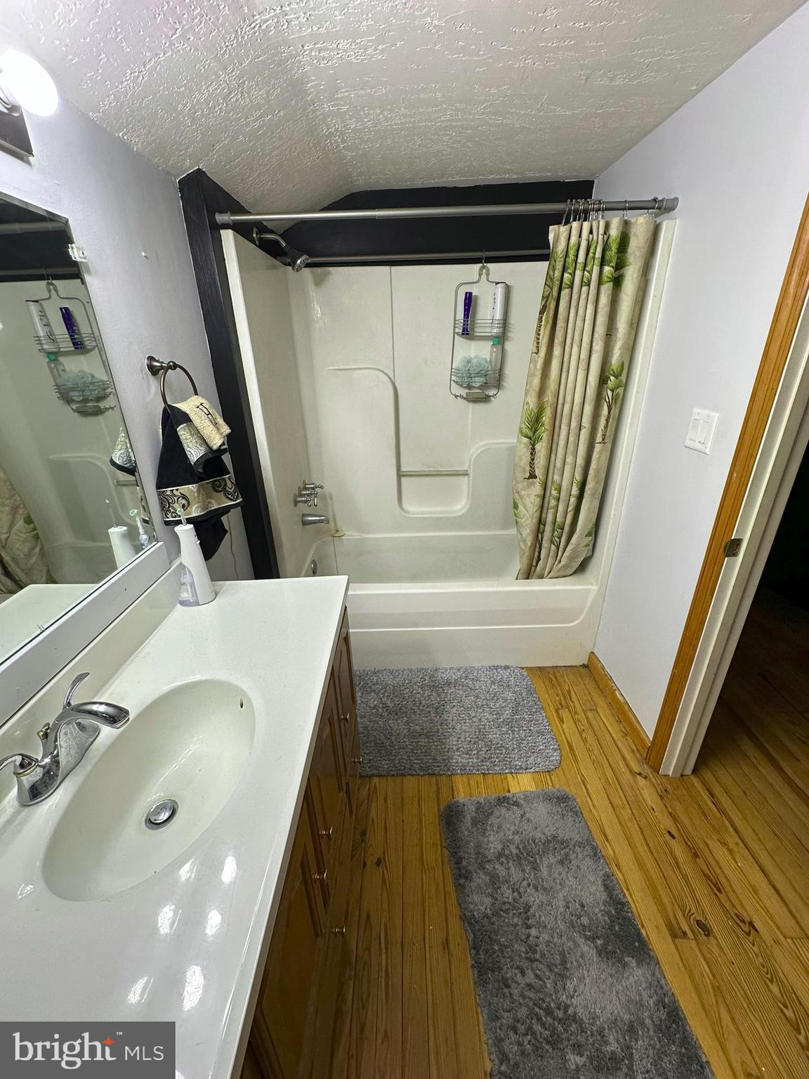 407 Upper Snake Spring Road Everett, PA 15537 - Photo 25 of 58 a bathroom with a tub and a sink