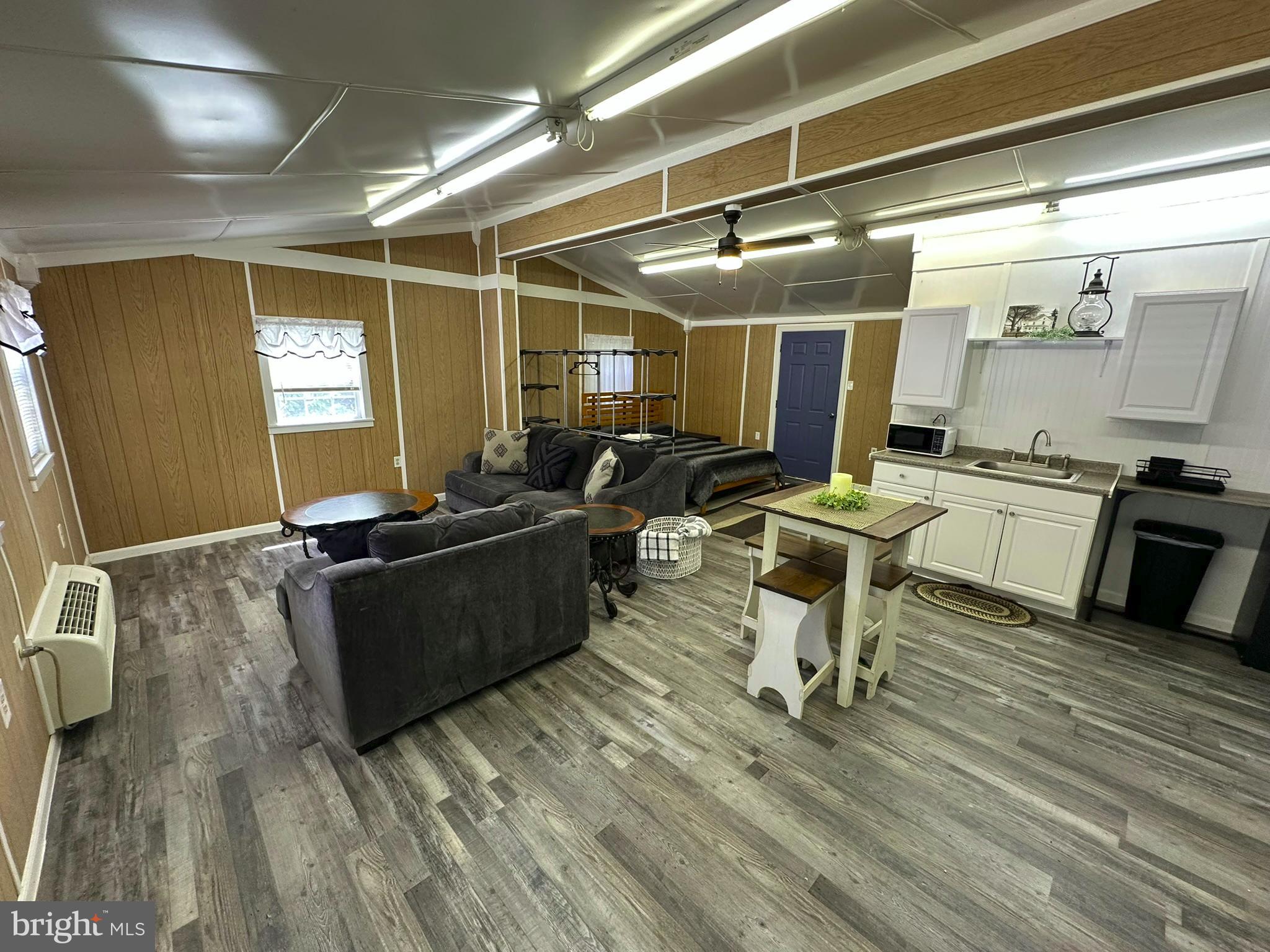 407 Upper Snake Spring Road Everett, PA 15537 - Photo 29 of 58 a kitchen with a sink and wooden floor