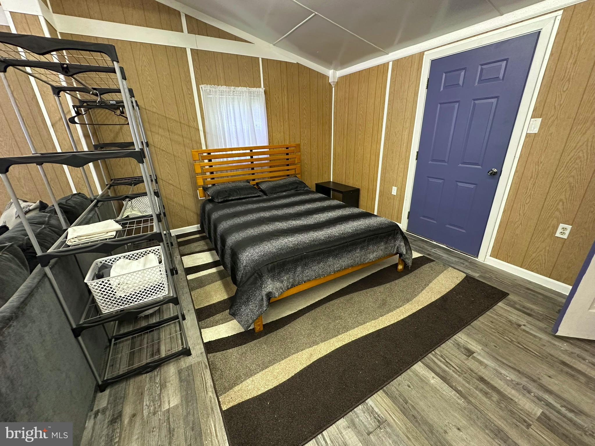 407 Upper Snake Spring Road Everett, PA 15537 - Photo 31 of 58 a bedroom with a bed and wooden floor