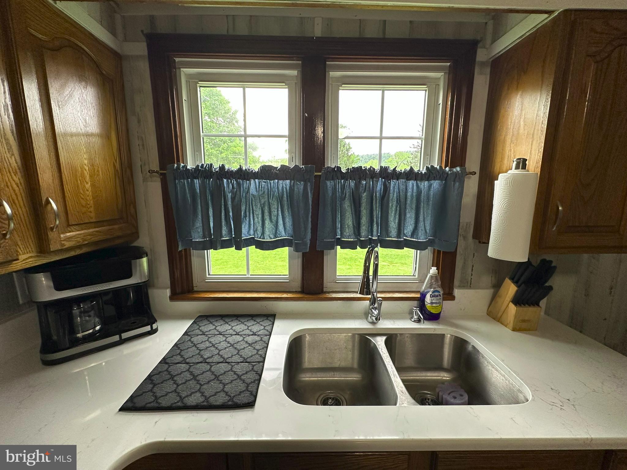 407 Upper Snake Spring Road Everett, PA 15537 - Photo 4 of 58 a kitchen with a sink and a large window