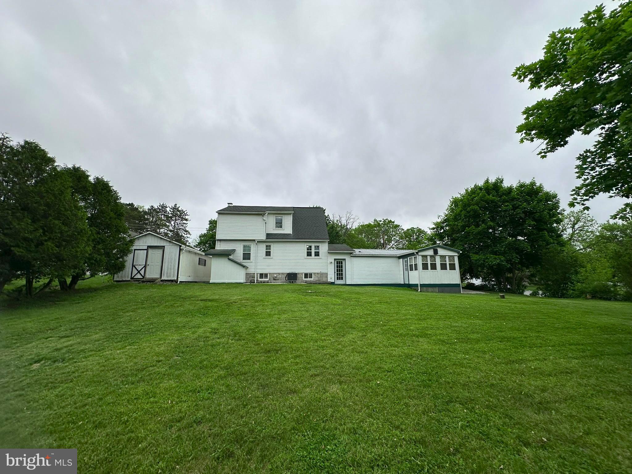 407 Upper Snake Spring Road Everett, PA 15537 - Photo 44 of 58 a house view with a garden space