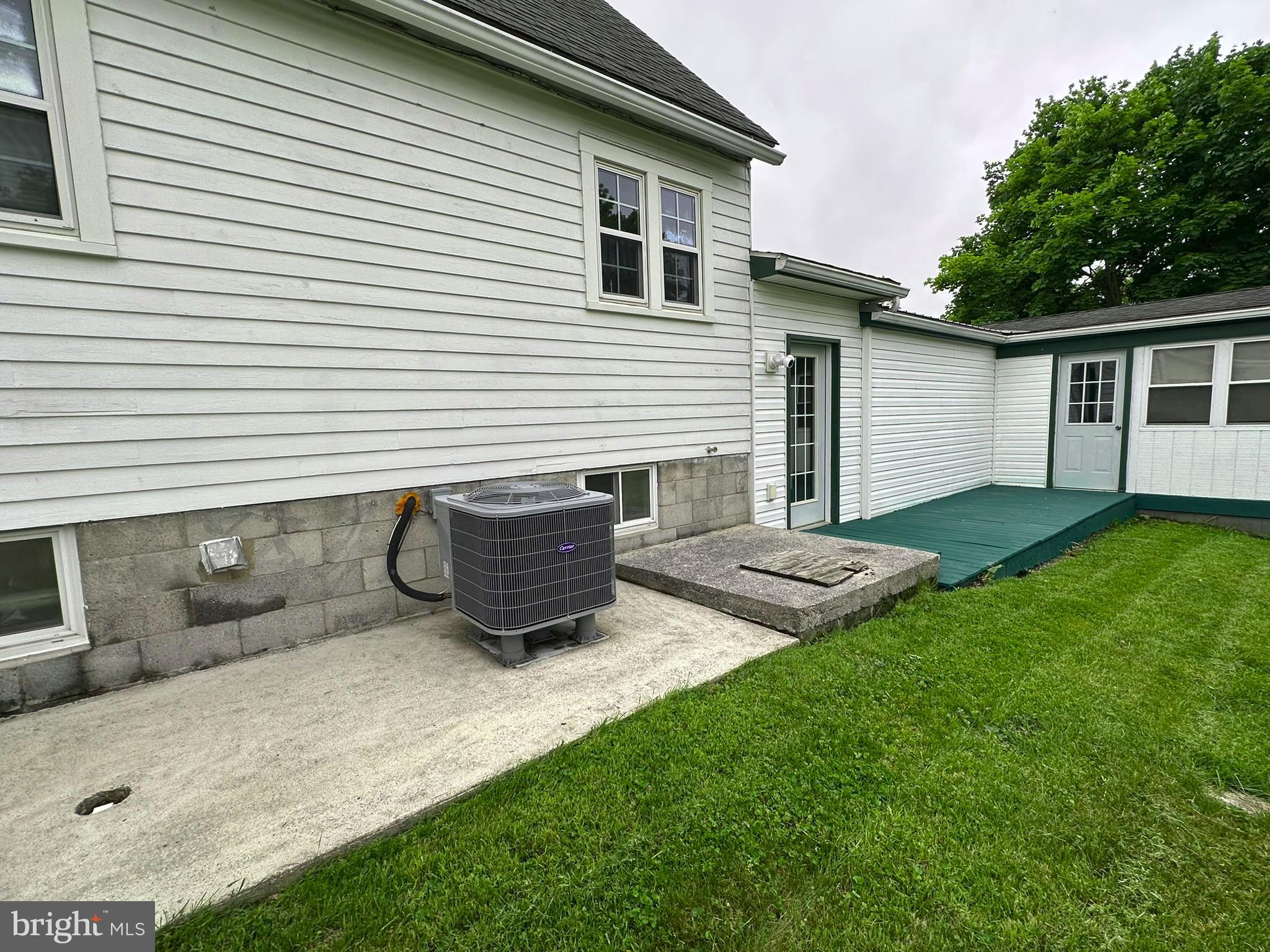 407 Upper Snake Spring Road Everett, PA 15537 - Photo 46 of 58 a view of a house with backyard and sitting area