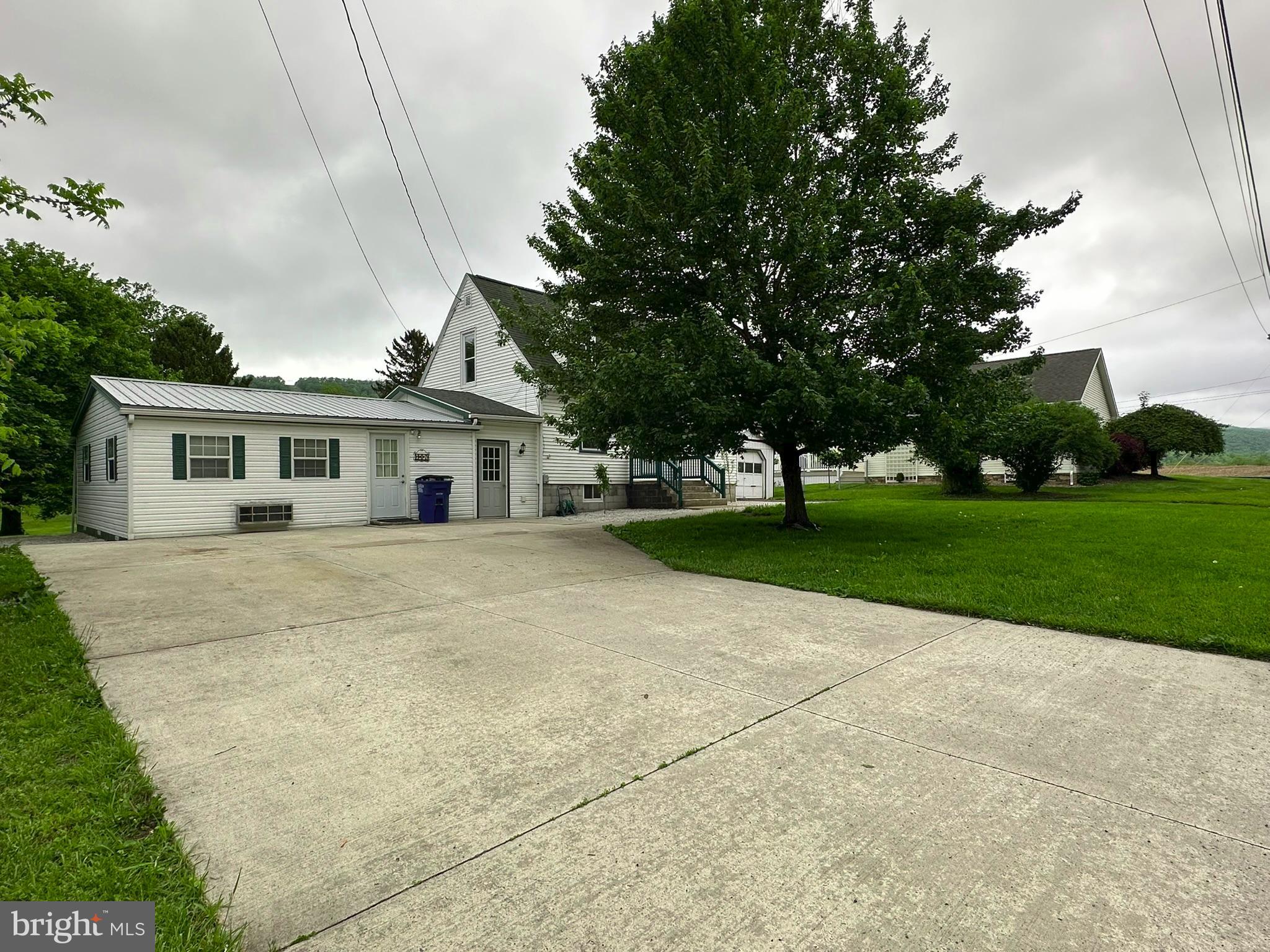 407 Upper Snake Spring Road Everett, PA 15537 - Photo 49 of 58 a front view of house with yard and green space
