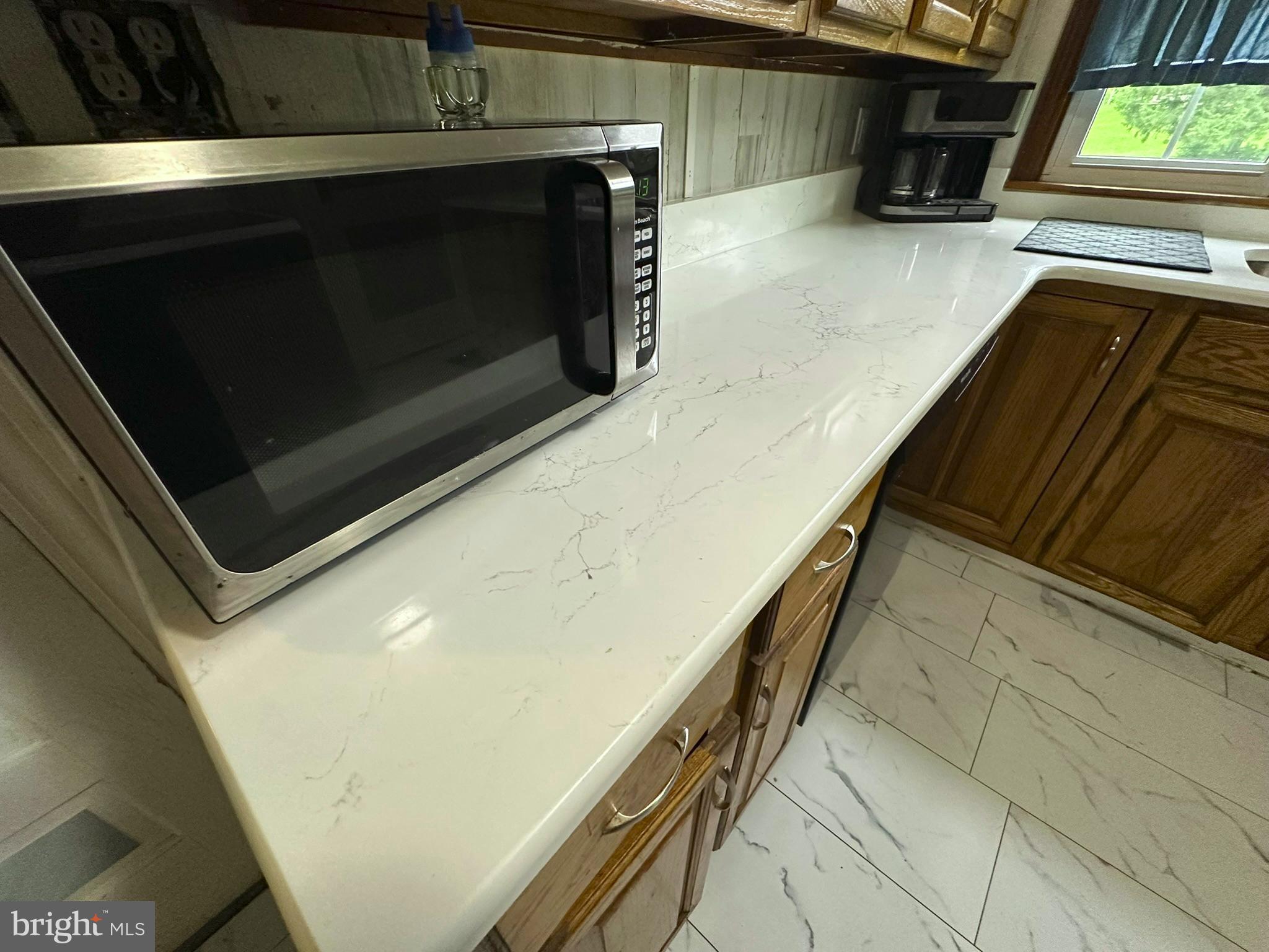407 Upper Snake Spring Road Everett, PA 15537 - Photo 7 of 58 a stove top oven sitting inside of a kitchen