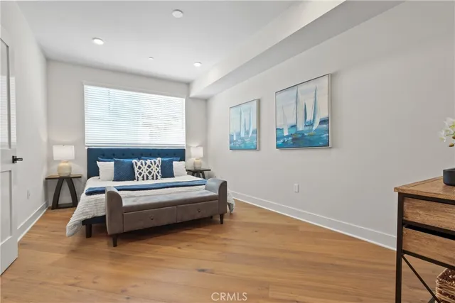 a spacious bedroom with a bed and a table